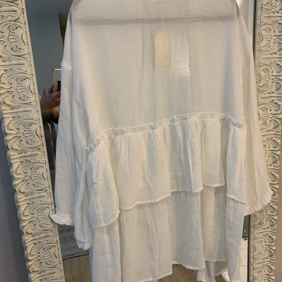 White tunic opens in front. Rufgles on trim. Could be bathing cover or blouse. - Picture 2 of 2
